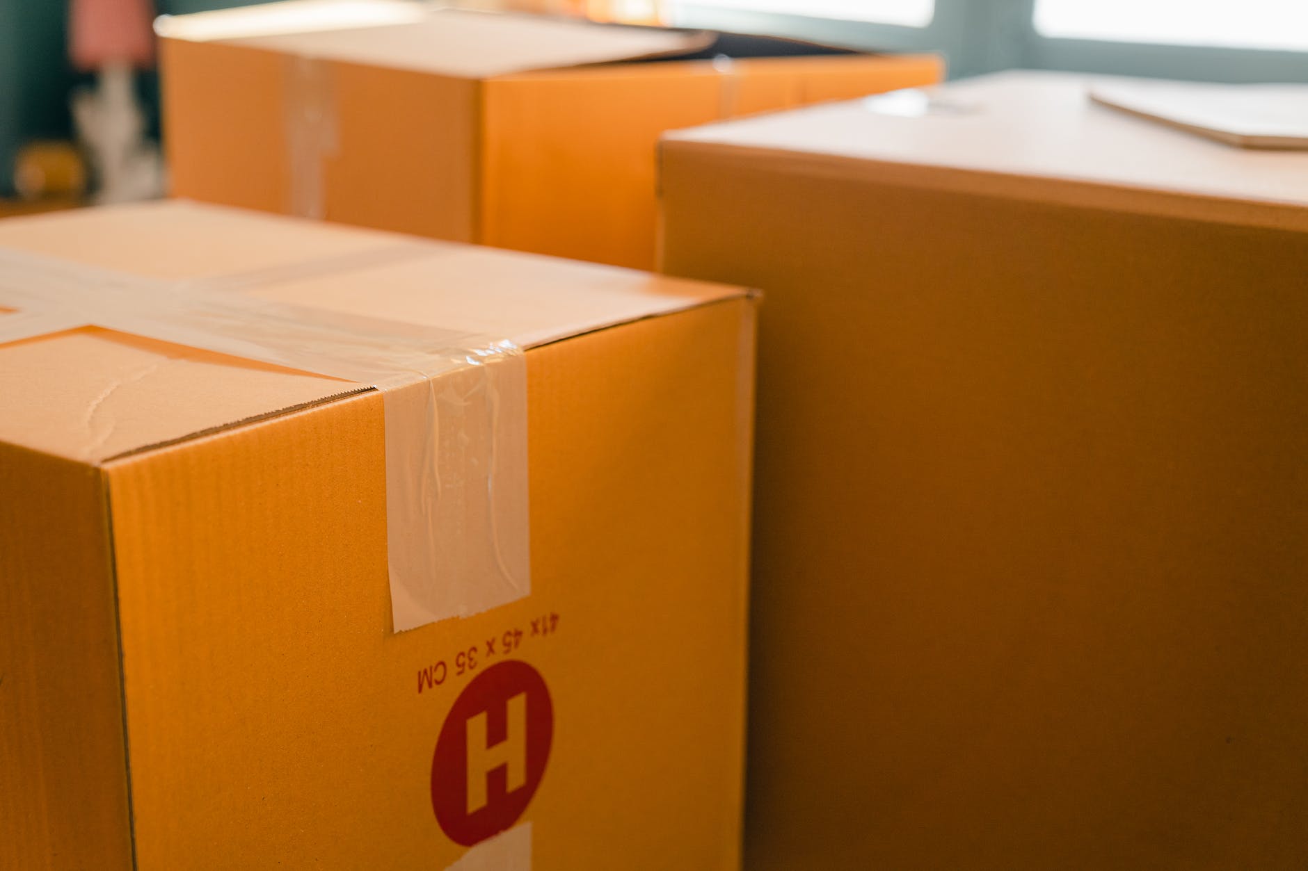 Sauna Shipping and Return Policy returns carton boxes near window in sunny room