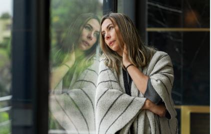 Mental health support women looking bord out the window with PTSD PSTD Treatments with Neuro-Emotional Therapy